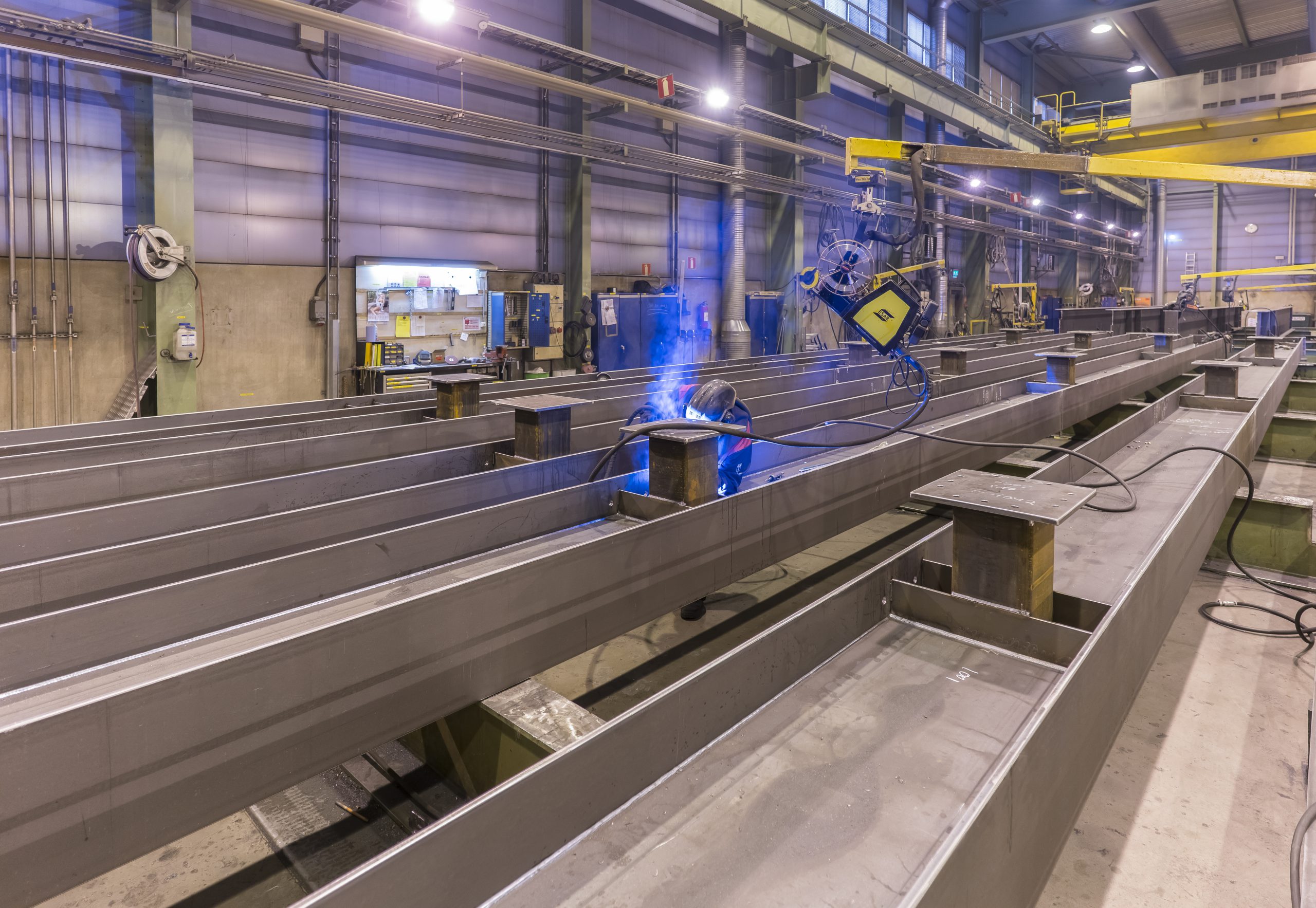 A welder welding a steel beam